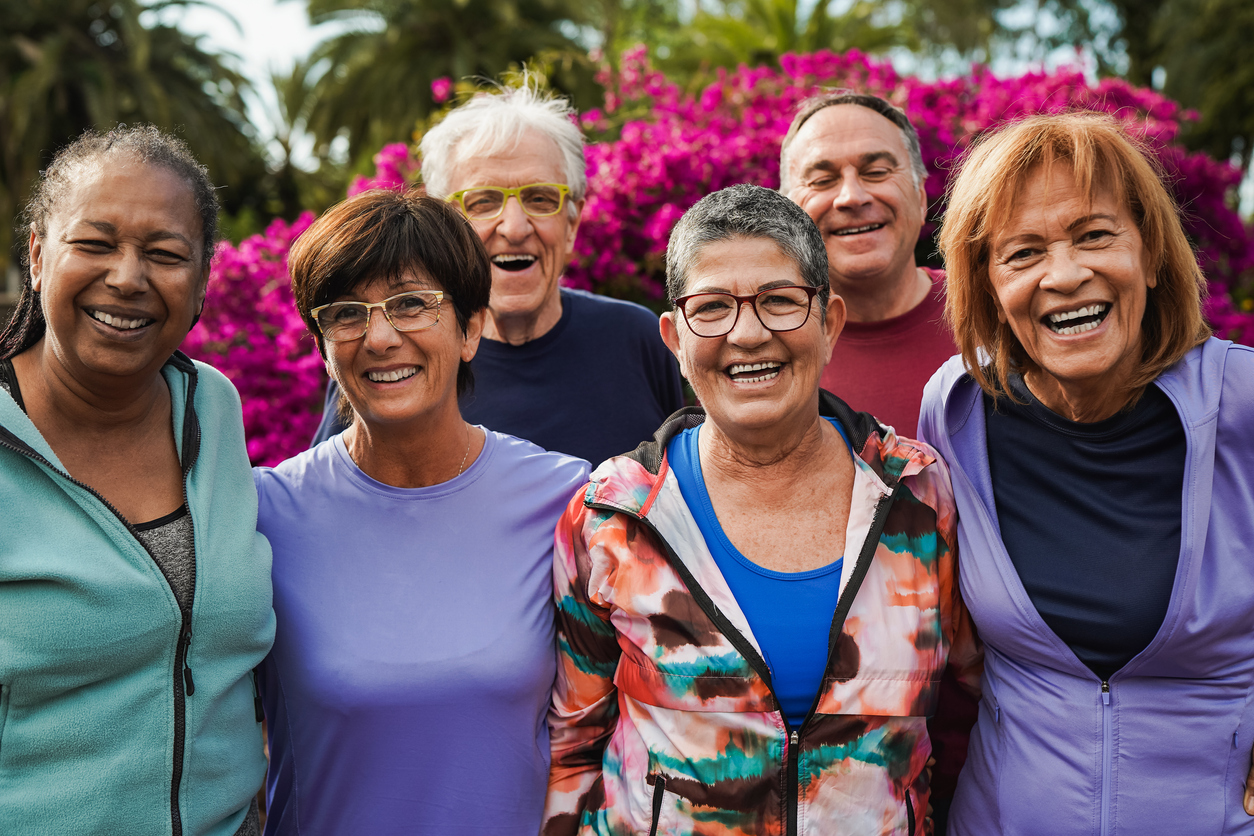 Group of senior friends smiling on camera after yoga lesson at city park Premier Senior Living in Porter County | AVIVA Valparaiso